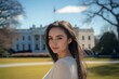 © Kenny - Young woman smiling in front of historical government building on a sunny day
