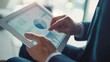 © Olga - Close-up of a financial advisor explaining tax strategies with a pie chart on a tablet