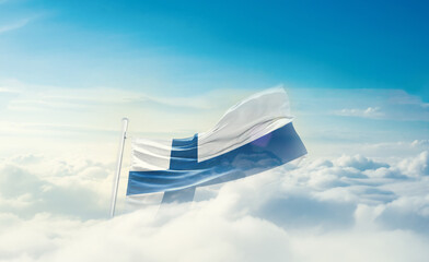 Finland national flag hidden in the sky. The flag with drone shot in beautiful clouds. Finland national flag for independence day.