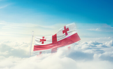 Georgia national flag hidden in the sky. The flag with drone shot in beautiful clouds. Georgia national flag for independence day.