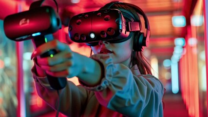 Aufkleber - The woman is fully immersed in a virtual reality experience, wearing a headset and gripping a controller, surrounded by colorful lights that enhance the atmosphere.