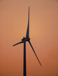 © DayDream - Wind turbine windmill at golden hour on orange sky at dusk