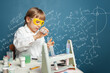 © millaf - Clever school student girl learning science. Research and education concept