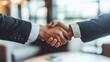 © songpol152 - Two business partners shaking hands after closing a deal in a modern corporate office, symbolizing success, partnership, and professionalism. Ideal for business promotions and corporate websites.