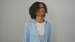 © Krakenimages.com - Young african american woman with curly hair making a confused expression, isolated over a white background wall.