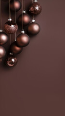 Wall Mural - Christmas vertical background. Christmas decorations with bronze and chocolate colored Christmas ornaments on dark brown background with copy space. mocha mousse. monochrome