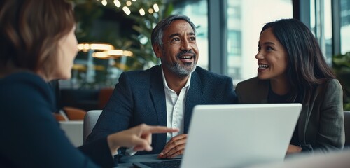 a business professional is presenting ideas to two other people in an office setting, with one perso