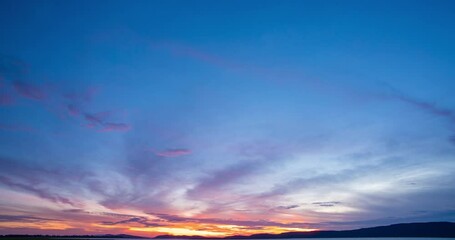 Wall Mural - Timelapse sunrise over the mountain horizonsky