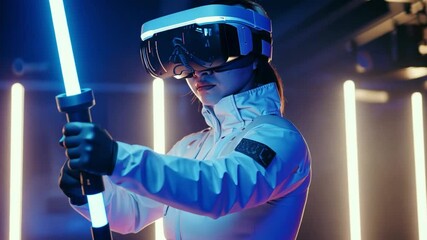 Aufkleber - Wearing a futuristic headset, an individual confidently wields a lit saber, immersed in a vibrant gaming arena filled with glowing lights.