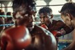 © spyrakot - Intense Boxing Training Session with Focused Fighters in Action - Perfect for Sports Posters or Editorial Design