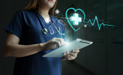 A female cardiac surgeon using tablet to check electrocardiography. Medical and healthcare, telemedicine, health tech.