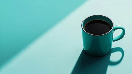 Canvas Print - A teal mug with a dark liquid on a blue background.