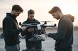 © Jiraphat - Technicians working on a drone during sunset, showcasing teamwork and innovation in technology and aerial equipment.