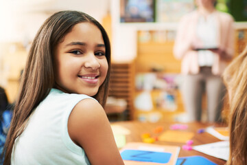 Poster - Girl, child and portrait in classroom with books, happy and lesson for education, development and progress. Kid, smile and excited for notes, language and scholarship for study at school in Mexico