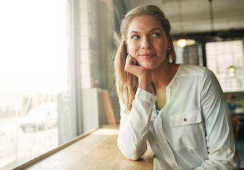 Poster - Business woman, happy and thinking in coffee shop, morning and decision for breakfast order in diner. Person, smile and start day at cafe, restaurant and relax with insight for inspiration at store