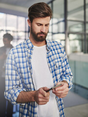 Leinwandbilder - Man, thinking and typing on smartphone for networking, communication or message in office. Designer, planning and creative idea on cellphone with social media and connection for email startup