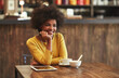 © peopleimages.com - Thinking, relax and happy woman at cafe for planning future, inspiration and creative menu ideas. Smile, dream and African person in coffee shop for reflection, peace and calm small business owner