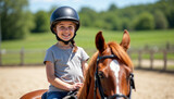 Happy young girl riding a horse in a sunny equestrian arena during her lesson.






