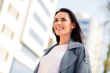 Sticker - Photo of charming positive woman wear grey trench smiling enjoying walk outdoors urban city street