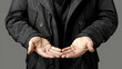 © HQAsset - Close-up Photograph of Two Hands Holding Something, Dressed in a Black Jacket