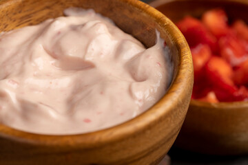 fresh natural yogurt with added strawberry flavor with berries