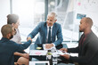© ThurstanJam/peopleimages.com - CEO, business people and shaking hands for partnership offer, crm or corporate deal. Smile, handshake or team in collaboration in meeting for b2b contract, investor acquisition or company integration