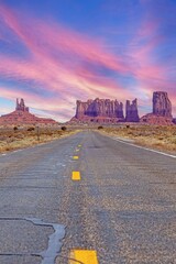 Panoramic picture along an empty road through Monument Valley