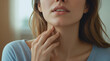 © Dwi - a woman touching painful neck, sore throat for flu, clod and infection