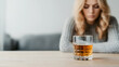 © photo for everything - Alcoholism Concept with Alcohol Glass and Woman in the Background | Struggle and Addiction Awareness