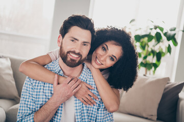 Poster - Portrait of two nice young people cuddle smile pastime weekend modern apartment indoors