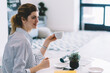 © BullRun - Happy female friends sitting at coffee table and enjoying warm conversations with each other during leisure, positive smiling women taking rest together and gossip during meeting in home interior