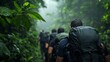 © tinnakorn - Group of hikers navigating through a lush green jungle, surrounded by misty plants and trees, showcasing adventure and exploration.