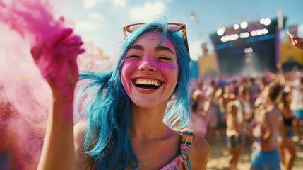 A joyful young woman with blue hair celebrates at a vibrant outdoor festival, surrounded by people.