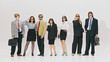 © Lustre Art Group  - Dynamic group, walking with confidence and style, perfectly blending oversized business suits and chic details in modern office look against white studio background. Concept of business and style. Ad