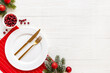 © 9dreamstudio - Festive table setting for Christmas and New Year Eve - plate with fir tree branch and decoration on white table, top view