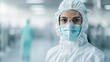 © Cheewynn - Biotech worker in full protective gear inside a pharmaceutical cleanroom, emphasizing industry safety standards, pharmaceutical cleanroom, biotech safety