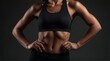 © weerayut - Fit woman in black sports bra showcasing toned abs