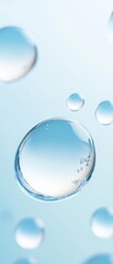 Wall Mural - three large, clear, and shiny water droplets floating in the air
