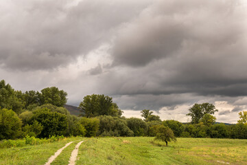 Sudden storm in the summer. Dark clouds. Climate change concept