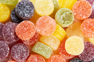 Sugar Coated Fruit Pastilles. Fruit flavored jelly pastilles on white background, top view. Lots of colors