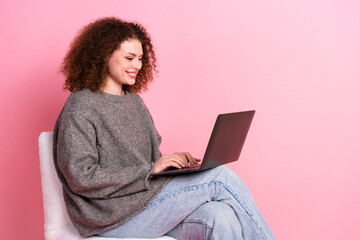 Canvas Print - Photo portrait of pretty young girl sit chair netbook wear trendy gray outfit isolated on pink color background