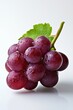 © Philipp - A bunch of dark grapes with water droplets, isolated on a white background in a close-up view.