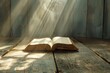© Isuru - Open Bible on a wood table with light coming from above.  Church concept.