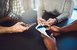 © SunriseDon/peopleimages.com - Phone, hands and people networking in circle for information, notification and online communication. Closeup, group diversity and download cellphone app for contact, iot data or social media software