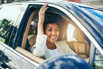 Woman, relax and happy to drive car for license, freedom to travel and road trip adventure. Driver, african person and parking motor vehicle for transport, new owner and excited for journey outdoor