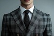 © Anjali - Young handsome man in classic suit with checked pattern