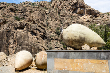 Wall Mural - old kvevri wine vessels and rocks in background