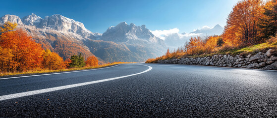 A road with a mountain in the background. The road is empty and the trees are orange