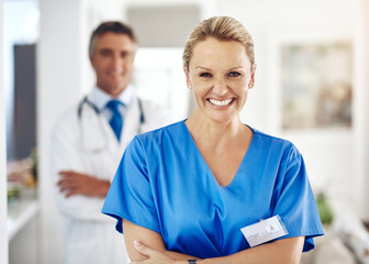 Poster - Mature woman, doctor and staff portrait with hospital, healthcare and clinic professional with confidence. Cardiology, stethoscope and wellness worker with happy and smile at ICU care job as surgeon