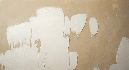 A brown wall with white plaster applied in places.